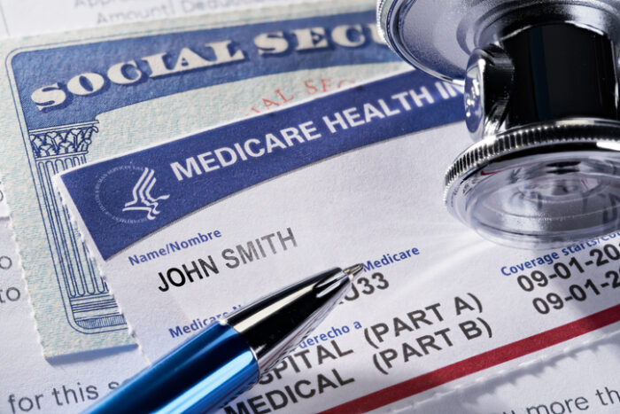 A close up of medicare cards and pen